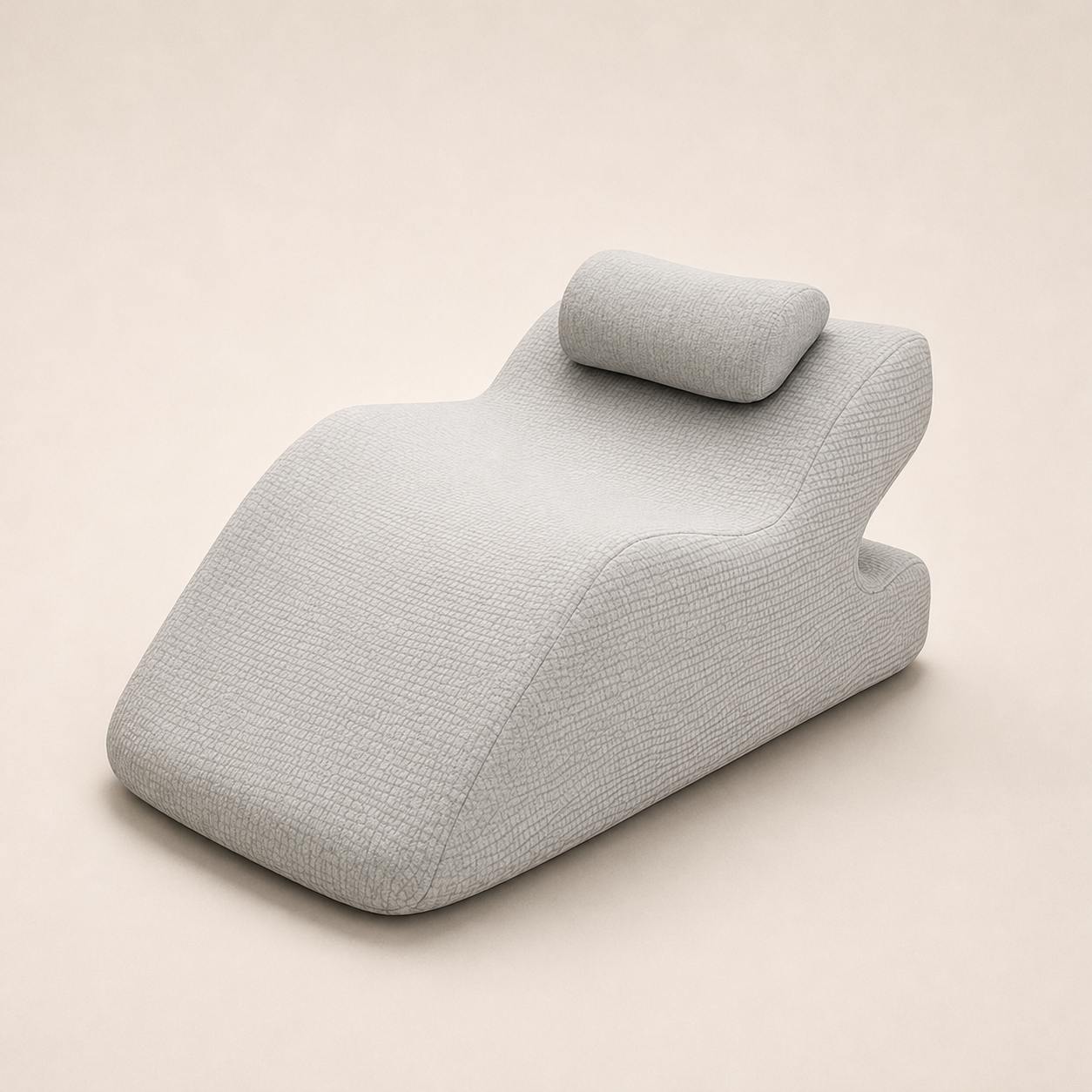 Gray wedge-shaped pillow on a beige background