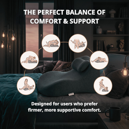 Gray sofa with a pillow labeled 'The Perfect Balance of Comfort & Support' in a dimly lit room.
